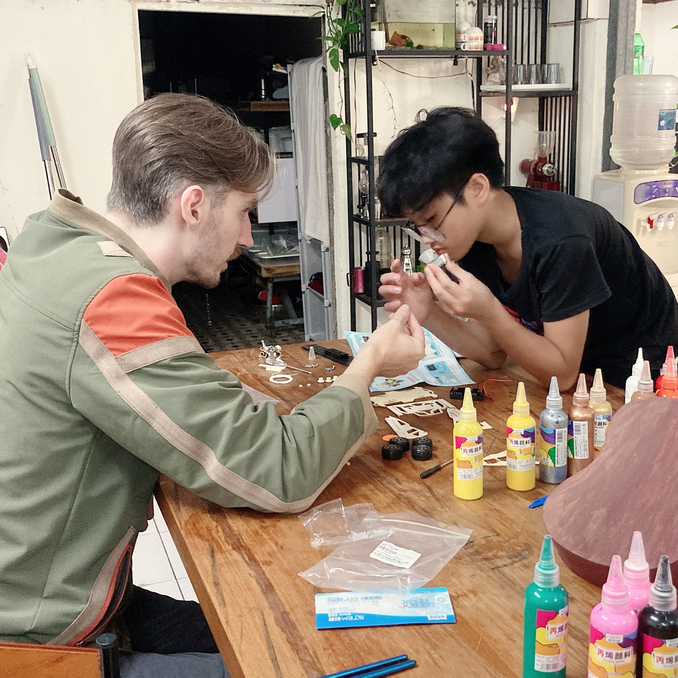 Zach and student working on an activity at SixTrees